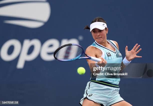 Caroline Dolehide of the United States returns a shot against Clara Burel of France during their Women's Singles First Round match on Day Two of the...