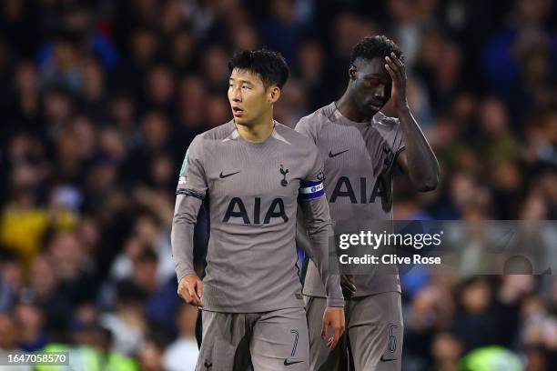 Heung-Min Son and Davinson Sanchez of Tottenham Hotspur look dejected after their loss in the penalty shoot out following the Carabao Cup Second...