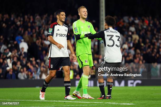 Raul Jimenez, Marek Rodak and Antonee Robinson of Fulham celebrate victory in the penalty shoot out following the Carabao Cup Second Round match...