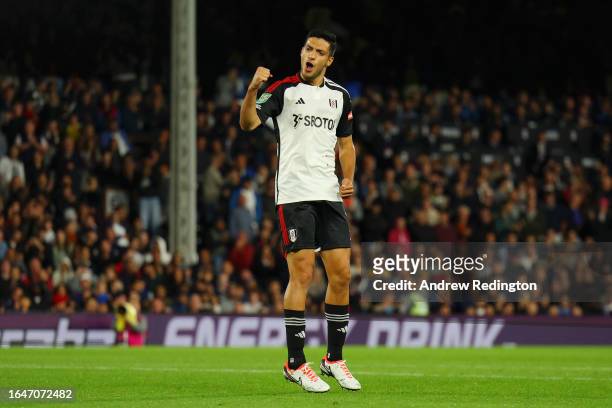 Raul Jimenez of Fulham celebrates scoring their side's second penalty in the penalty shoot out during the Carabao Cup Second Round match between...