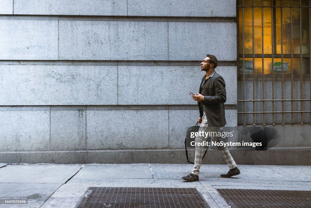 Businessman rushing to the office in Wall Street