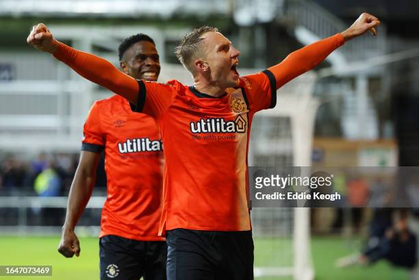 Cauley Woodrow of Luton Town celebrates after scoring the team's third goal during the Carabao Cup Second Round match between Luton Town and...