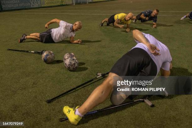 Ukrainian amputee soldiers with others attend a football training session in Kyiv, on August 31 amid the Russian invasion of Ukraine. Once or twice a...