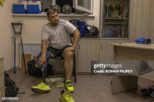 Oleksandr Malchevskiy a Ukrainian amputee soldier who lost part of his right leg during a combat mission near Kharkiv, sits in a dressing room before...