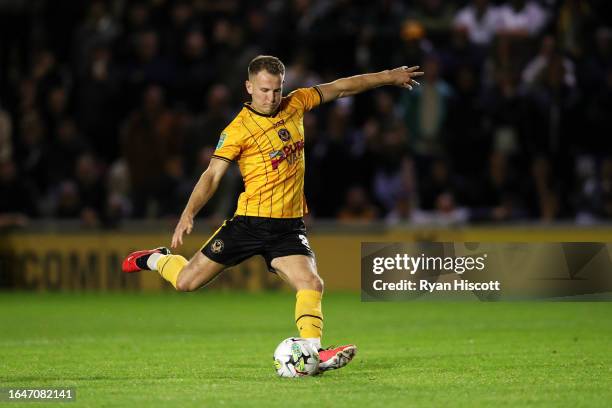 Bryn Morris of Newport County takes the third penalty which is saved during the Carabao Cup Second Round match between Newport County and Brentford...