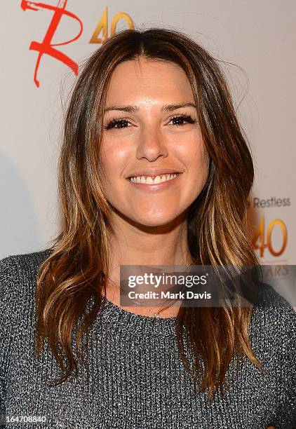 Actress Elizabeth Hendrickson poses at 'The Young & The Restless' 40th anniversary cake-cutting ceremony at CBS Television City on March 26, 2013 in...
