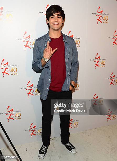 Actor Max Ehrich poses at 'The Young & The Restless' 40th anniversary cake-cutting ceremony at CBS Television City on March 26, 2013 in Los Angeles,...