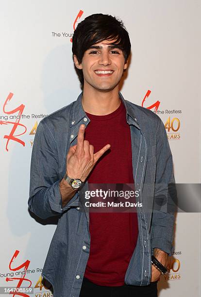 Actor Max Ehrich poses at 'The Young & The Restless' 40th anniversary cake-cutting ceremony at CBS Television City on March 26, 2013 in Los Angeles,...