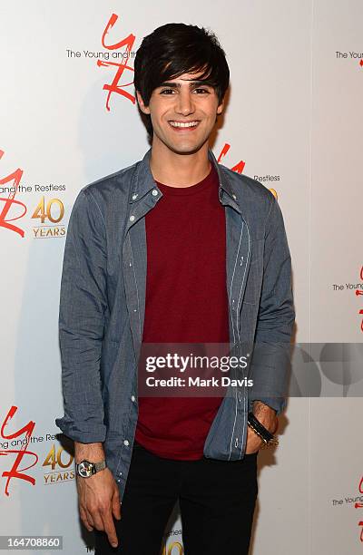 Actor Max Ehrich poses at 'The Young & The Restless' 40th anniversary cake-cutting ceremony at CBS Television City on March 26, 2013 in Los Angeles,...