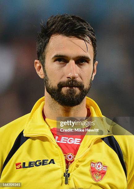 Mirko Vucinic of Montenegro lines up for the National Anthems prior to the FIFA 2014 World Cup Group H Qualifier between Montenegro and England at...