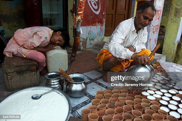 Lassi drinks are prepared for devotees arriving at the Shriji Temple , at Barsana, during Lathmar Holi. It is held during a full moon and the town...