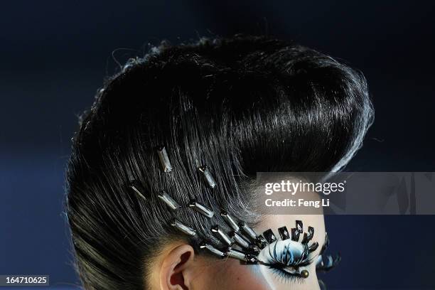 Model showcases designs on the catwalk during MGPIN Make-up Styling Collection on the fourth day of Mercedes-Benz China Fashion Week Autumn/Winter...