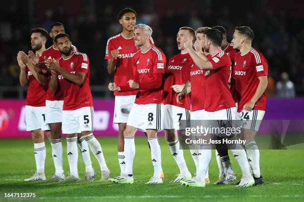 Salford City players celebrate in the penalty shootout during the Carabao Cup Second Round match between Salford City and Leeds United at Peninsula...