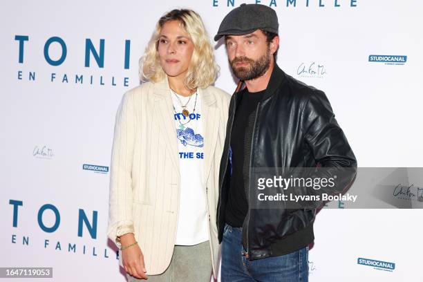 Alysson Paradis and Guillaume Gouix attend the Toni En Famille Premiere at Pathe Convention on August 29, 2023 in Paris, France.