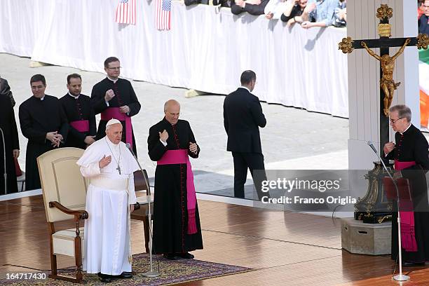 Pope Francis, flanked by his private secretary Alfred Xuereb , attends his first weekly general audience as pope in St Peter's Square on March 27,...