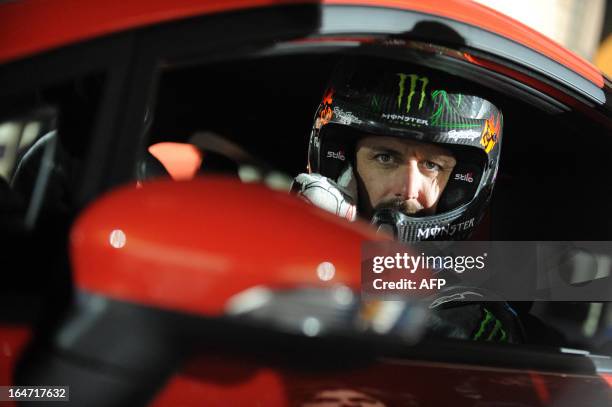 Driver Ken Block of Hoonigan Racing Division Team, formerly known as the Monster World Rally Team, poses for a photo in a Ford Fiesta ST type car on...