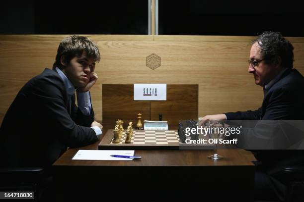 Magnus Carlsen , the world's number one chess player, prepares to play Israel's Boris Gelfand in the Candidates Tournament at the IET on Savoy Place...