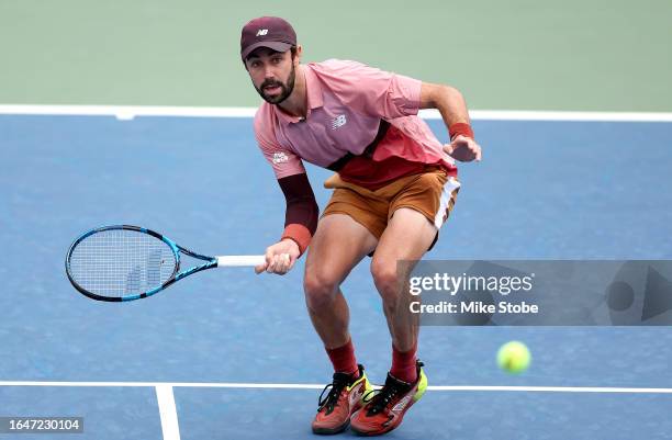 Jordan Thompson of Australia returns a shot against Botic Van De Zandschulp of the Netherlands during their Men's Singles First Round match on Day...