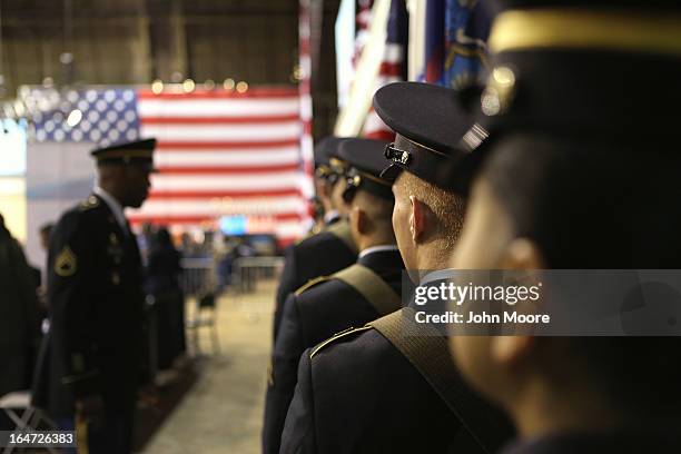 Military honor guard prepares to present the colors at the Hiring Our Heroes job fair held on March 27, 2013 in New York City. Hundreds of U.S....