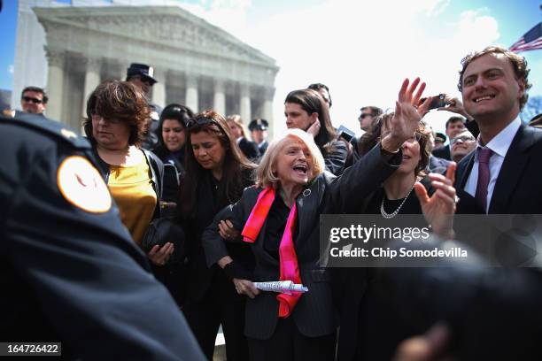 Edith Windsor is mobbed by journalists and supporters as she leaves the Supreme Court March 27, 2013 in Washington, DC. The Supreme Court heard oral...