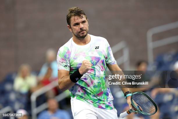 Stan Wawrinka of Switzerland celebrates a point against Yoshihito Nishioka of Japan during their Men's Singles First Round match on Day Two of the...