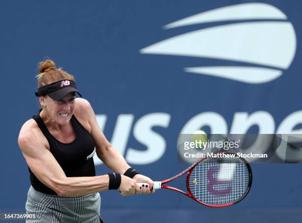 Madison Brengle of the United States returns a shot against Linda Noskova of the Czech Republic during their Women's Singles First Round match on Day...