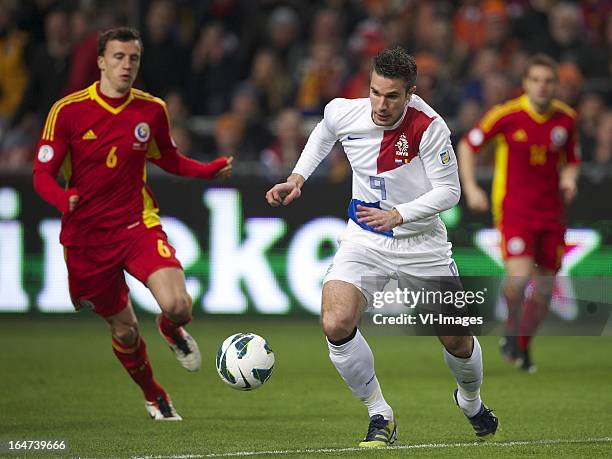 Vlad Iulian Chirches of Romania, Robin van Persie of Holland during the FIFA 2014 World Cup qualifier match between the Netherlands and Romania at...