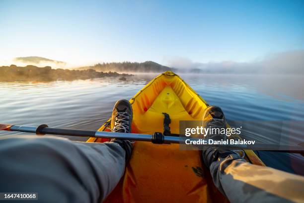 people and nature, pov. kayaking in lake at sunrise. - ponto de vista imagens e fotografias de stock