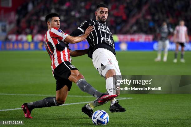 Jorge Agustin Rodriguez of Estudiantes fights for the ball with Renato Augusto of Corinthians during a Copa CONMEBOL Sudamericana 2023 quarterfinal...