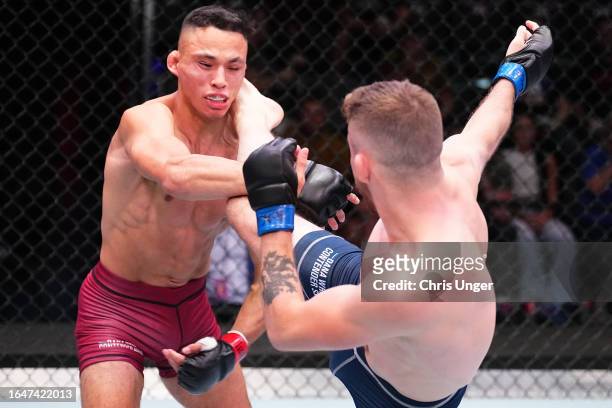 Mateo Vogel of Canada kicks the head of Timothy Cuamba in their featherweight fight during Dana White's Contender Series season seven, week four at...
