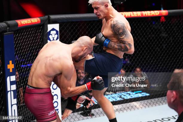 Marco Tulio of Brazil lands a knee to the body of Yousri Belgaroui of The Netherlands in their middleweight fight during Dana White's Contender...