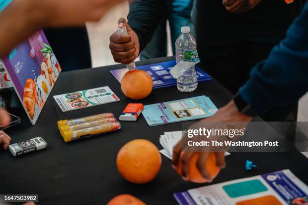 August 25, 2023 Students at Northwestern University in Chicago, Illinois, practice using an Epinephrine injection pen on oranges to know how to use...