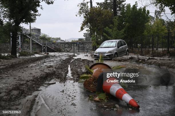 Car is damaged after the street is flooded during a heavy rain in Volos, Greece on September 6, 2023.