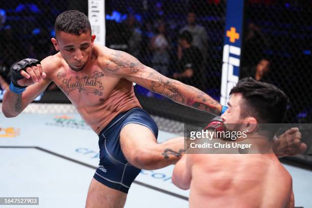 Carlos Prates of Brazil kicks Mitch Ramirez in their welterweight fight during Dana White's Contender Series season seven, week four at UFC APEX on...
