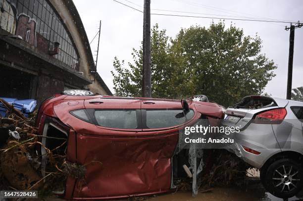 Cars are damaged after the street is flooded during a heavy rain in Volos, Greece on September 6, 2023.