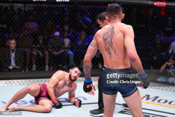 Carlos Prates of Brazil looks over Mitch Ramirez after knocking him down in their welterweight fight during Dana White's Contender Series season...