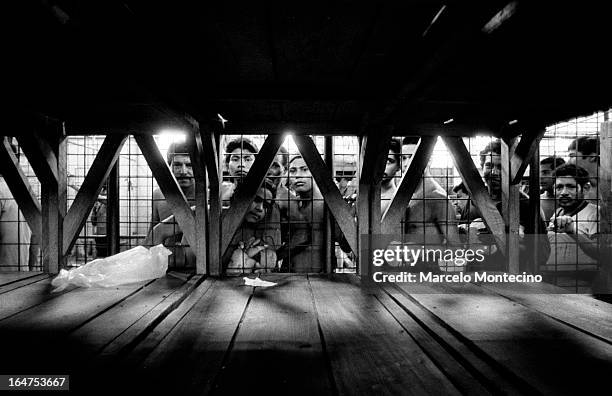 Political prisoners huddle in Mananagus's Central Police station. September, 1983