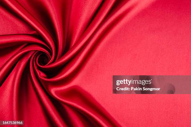 red color fabric cloth polyester texture and textile background. - roll shirt stock pictures, royalty-free photos & images