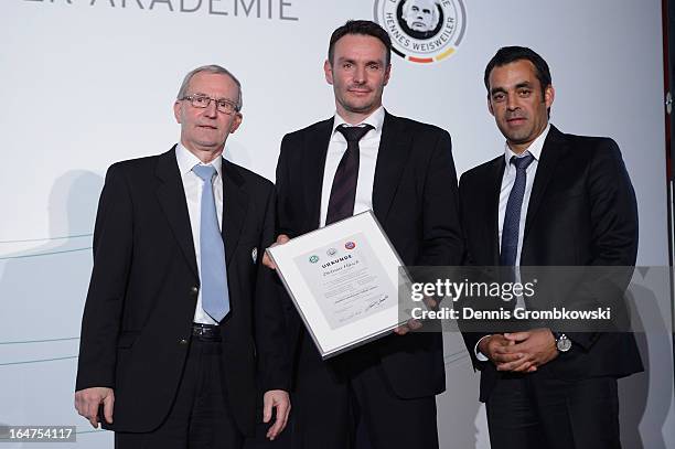 Dietmar Hirsch is honoured by Rainer Milkoreit and Robin Dutt during the Coaching and Technichal Development Course Awarding Ceremony on March 27,...