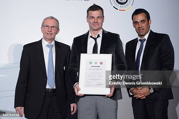 Karsten Hutwelker is honoured by Rainer Milkoreit and Robin Dutt during the Coaching and Technichal Development Course Awarding Ceremony on March 27,...