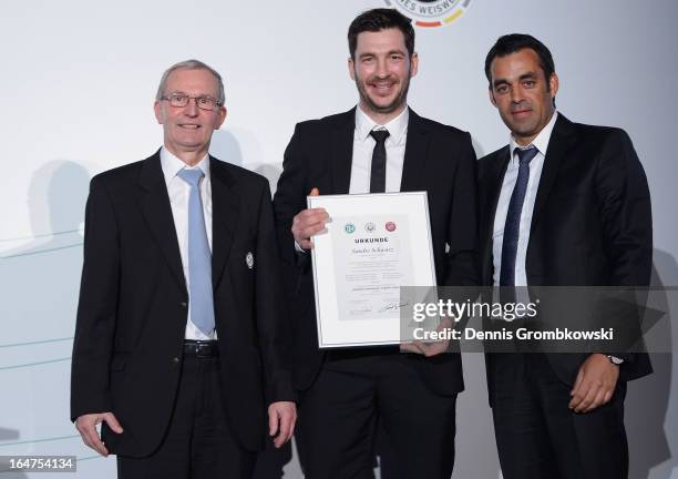 Sandro Schwarz is honoured by Rainer Milkoreit and Robin Dutt during the Coaching and Technichal Development Course Awarding Ceremony on March 27,...