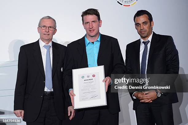 Daniel Stendel is honoured by Rainer Milkoreit and Robin Dutt during the Coaching and Technichal Development Course Awarding Ceremony on March 27,...