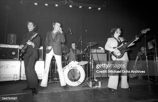 Guitarist Wilko Johnson, singer Lee Brilleaux, drummer John 'The Big Figure' Martin and bassist John B. Sparks of the English R&B group Dr. Feelgood...