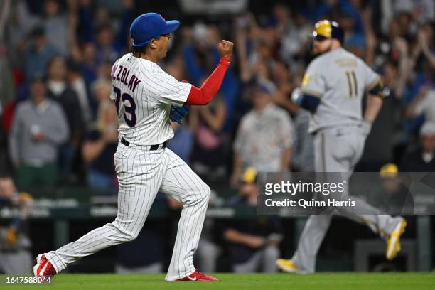 Relief pitcher Adbert Alzolay of the Chicago Cubs reacts after the final out in ninth inning against Rowdy Tellez of the Milwaukee Brewers at Wrigley...