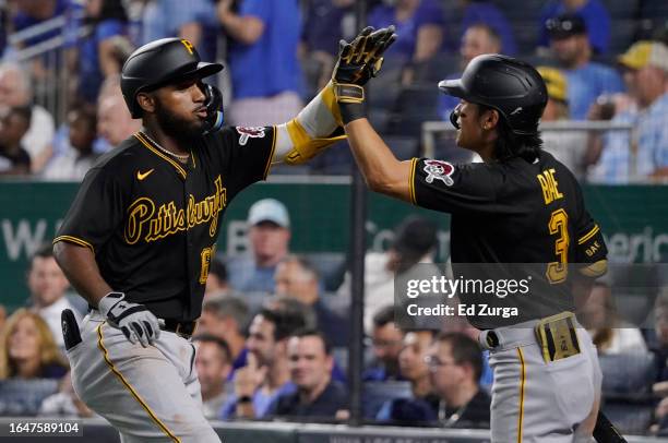 Liover Peguero of the Pittsburgh Pirates celebrates his three-run home run with Ji Hwan Bae of the Pittsburgh Pirates in the ninth inning against the...