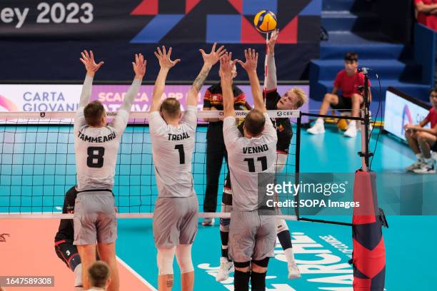 Mathijs Desmet of Belgium, Oliver Venno, Henri Treial and Märt Tammearu of Estonia in action during the Final Round Day 7 of the Men's CEV Eurovolley...