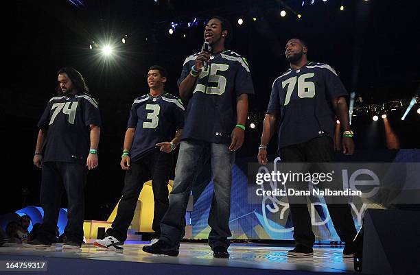 Seattle Seahawks players John Moffitt, #3 QB Russell Wilson, #25 Richard Sherman and Russell Okung show their support for youth activism in their...