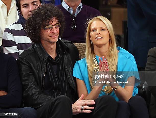 Howard Stern and Beth Ostrosky Stern attend the game between the New York Knicks and the Memphis Grizzlies at Madison Square Garden on March 27, 2013...
