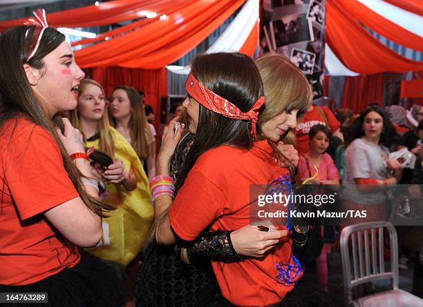 Taylor Swift meets fans in Club Red after her show at the Prudential Center on March 27, 2013 in Newark, New Jersey. Seven-time GRAMMY winner Taylor...