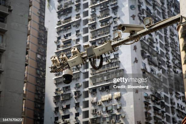 Surveillance cameras on a pole in Chongqing, China, on Sunday, Sept. 3, 2023. China is no longer set to eclipse the US as the world's...